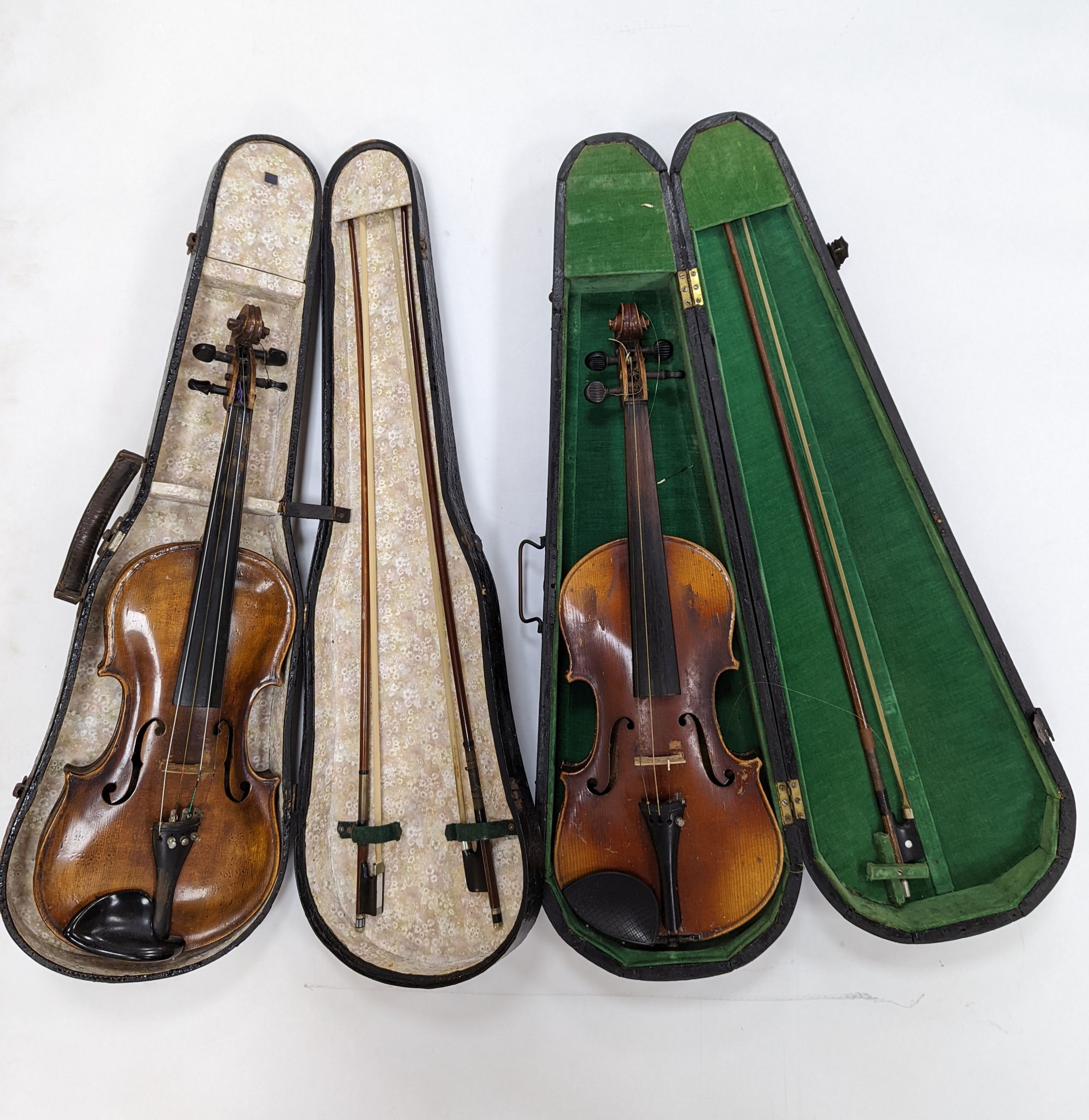 Two cased violins and bows, one with ‘Antonius Straduarius Cremonensis Faciebat Anno 17/13 Made In Czechoslovakia’ label to interior